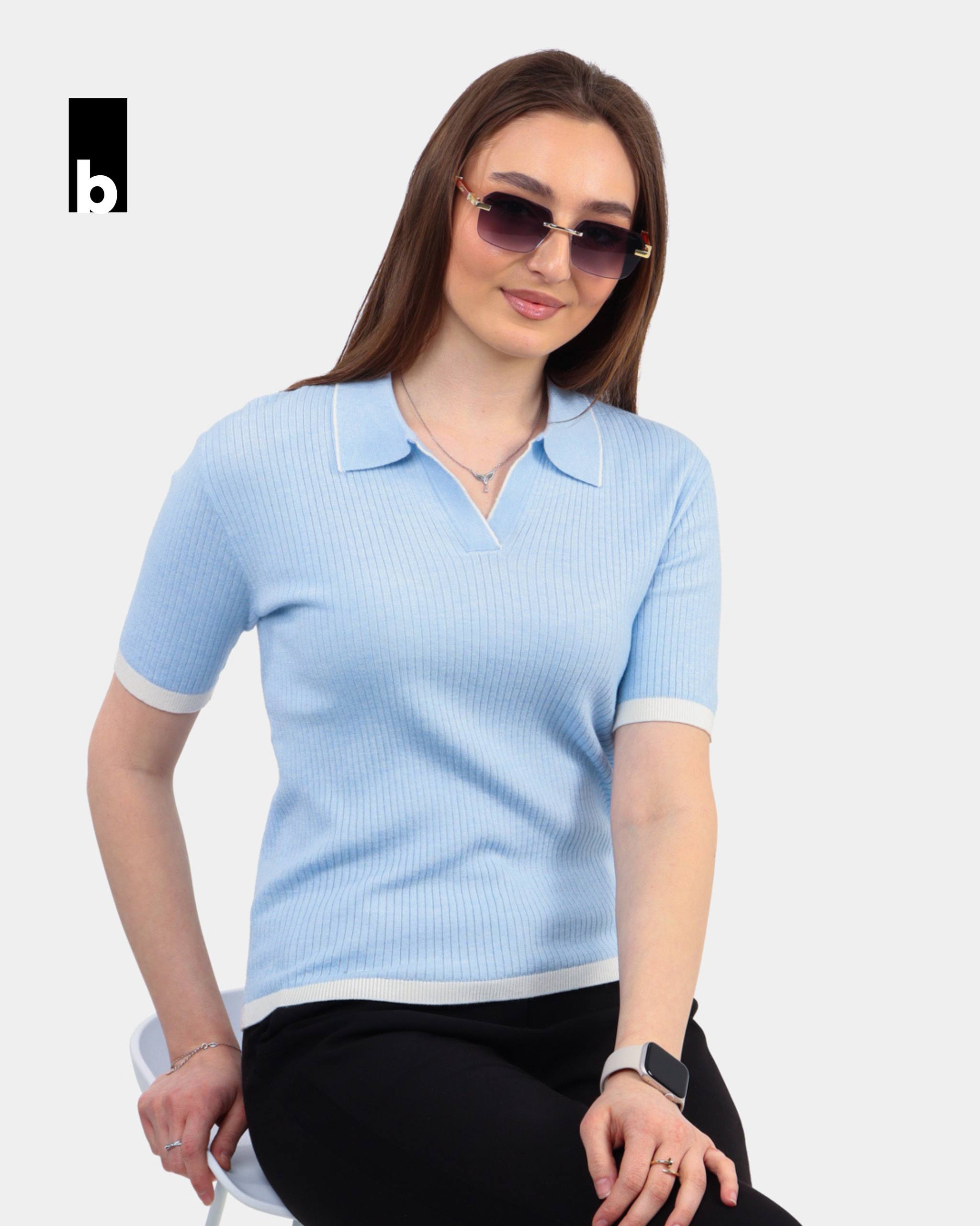 Knitted polo in light blue color with white trim on the collar and sleeves
